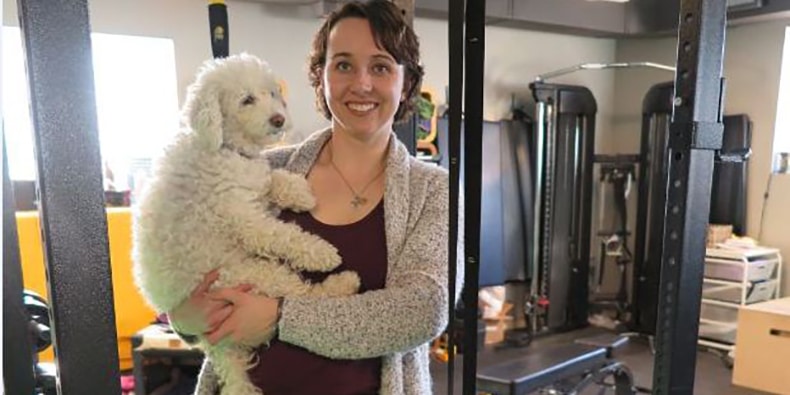 Meagan Hazlewood, owner of BeFit, at her studio just off Whyte Avenue with her dog, Bena