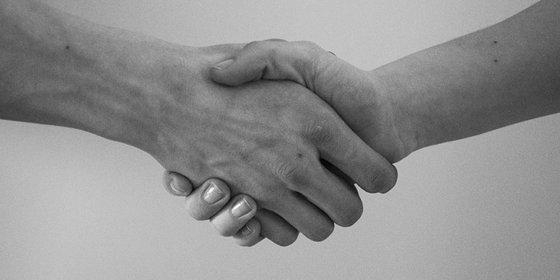 Black and white photo of handshake