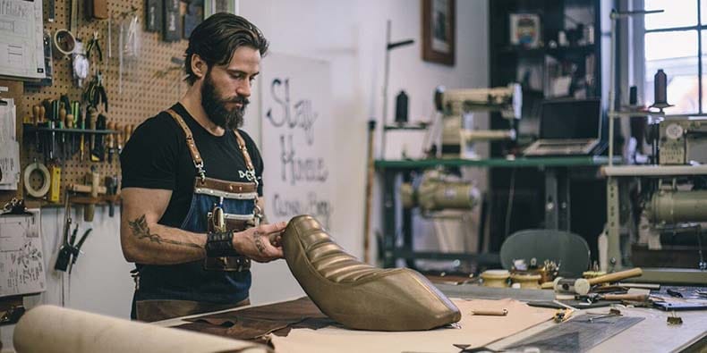 Kyle Closen working with leather in his shop