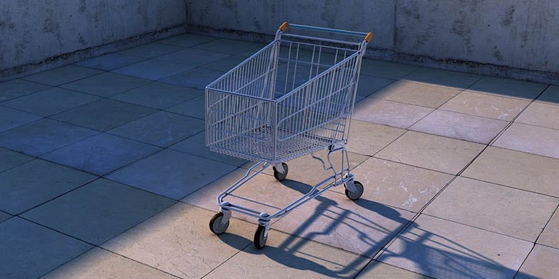 Shopping cart in concrete parking lot