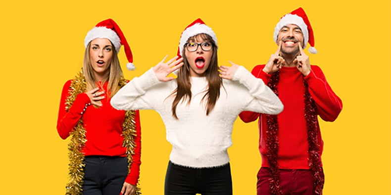 Blonde woman dressed up for christmas holidays surprised and shocked. Expressive facial emotion