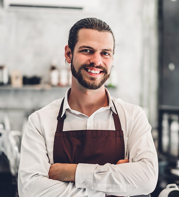Portrait of handsome bearded barista man small business owner sm