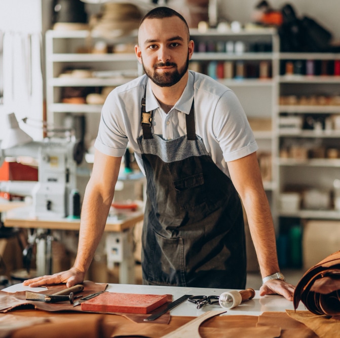 male-designer-leather-tailor-working-factory 6