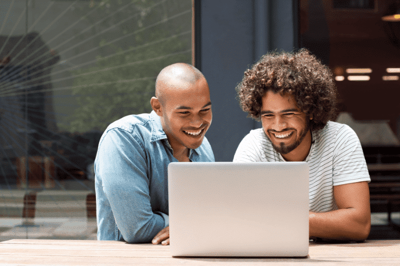 two young men looking a laptop | Business Link Business Model Canvas