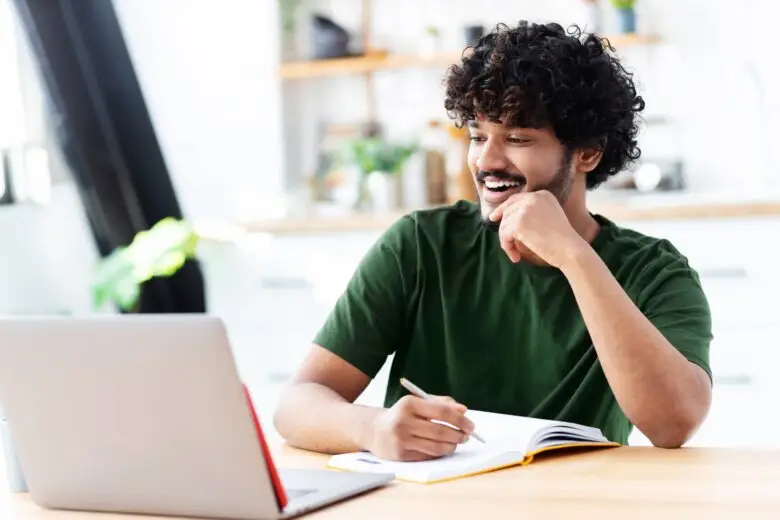 indian,young,man,using,laptop,for,watching,webinar,,studying,online