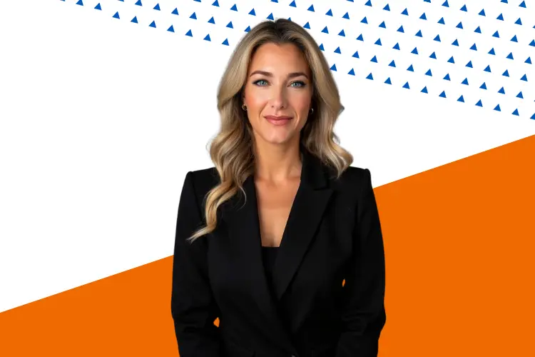 Professional woman with long wavy blonde hair wearing a black blazer, smiling confidently against a modern background with diagonal orange and white sections and a pattern of small blue triangles.