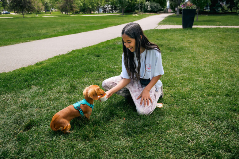Ritesh Andleys daughter feeding a dog Pupslurp ice cream