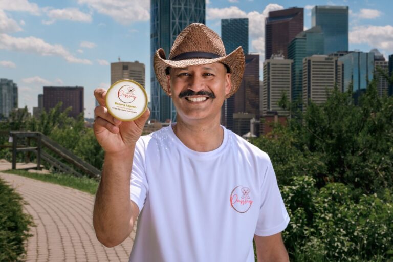 Ritesh Andley, founder of PupSlurp in Calgary, holding his natural frozen treats for dogs.